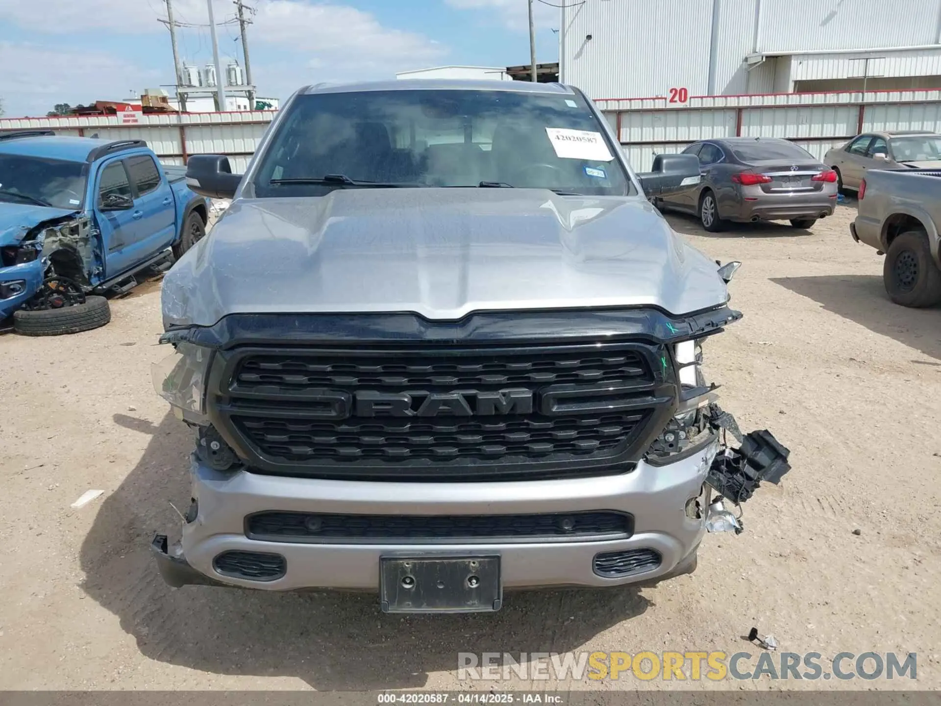 13 Photograph of a damaged car 1C6RREFT2NN253608 RAM 1500 2022