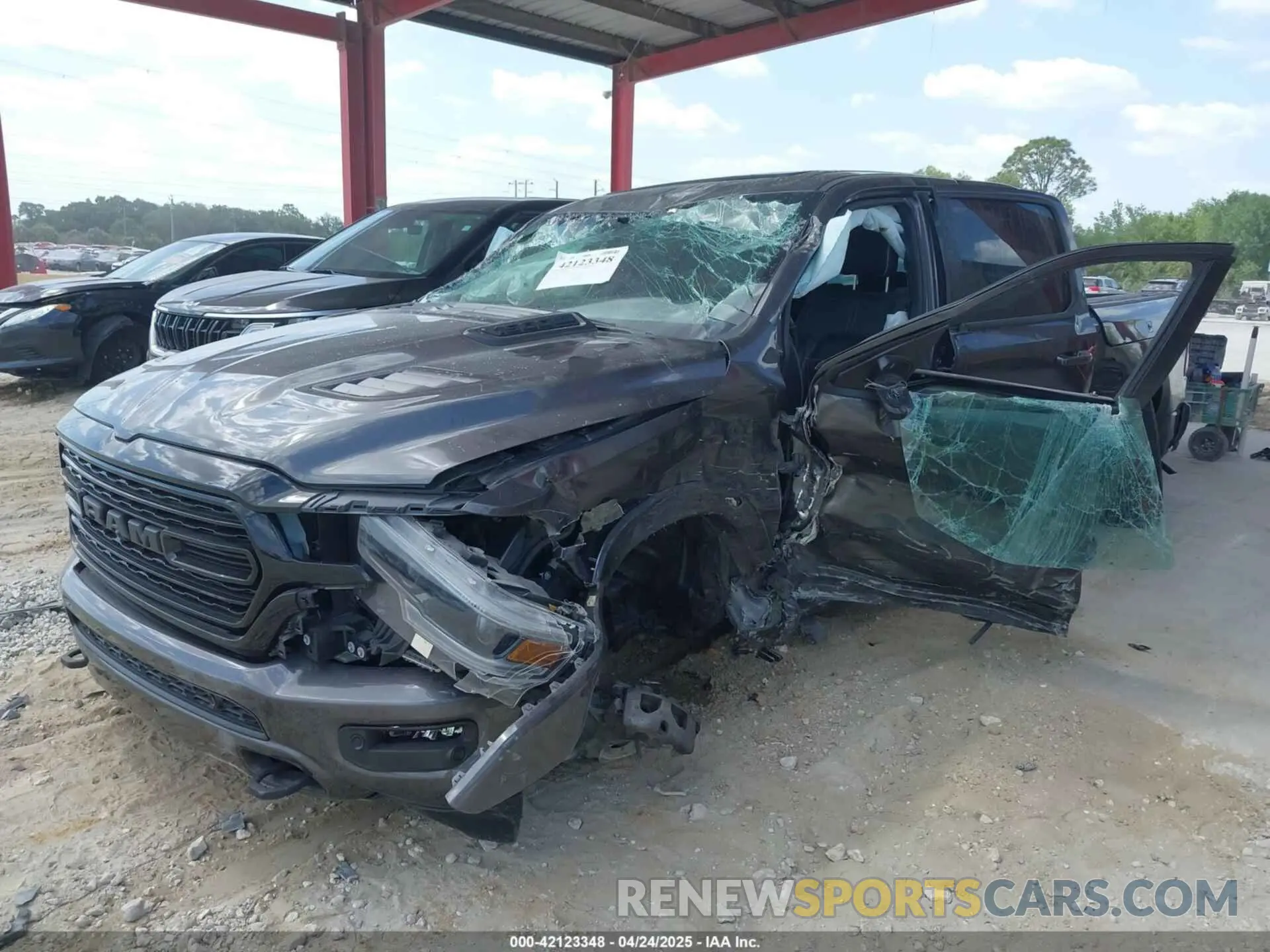 2 Photograph of a damaged car 1C6RREHT8NN187076 RAM 1500 2022
