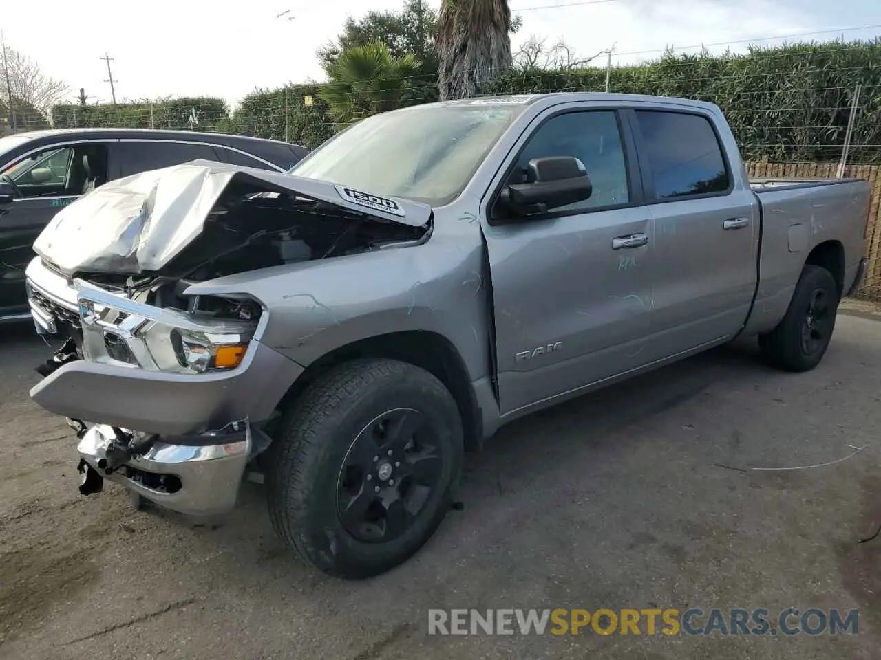 1 Photograph of a damaged car 1C6RREMT0NN382689 RAM 1500 2022