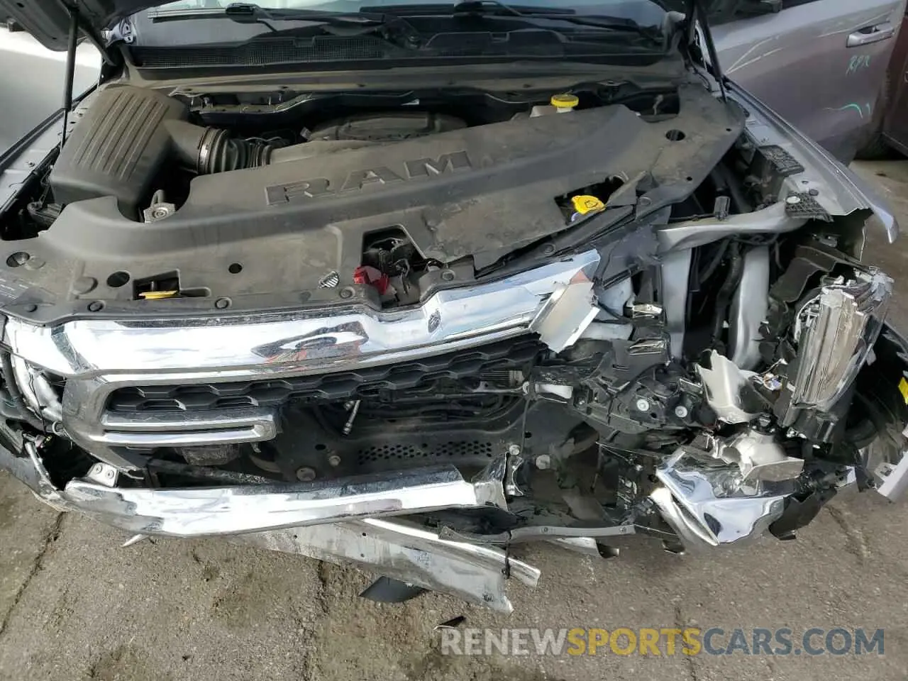 11 Photograph of a damaged car 1C6RREMT0NN382689 RAM 1500 2022