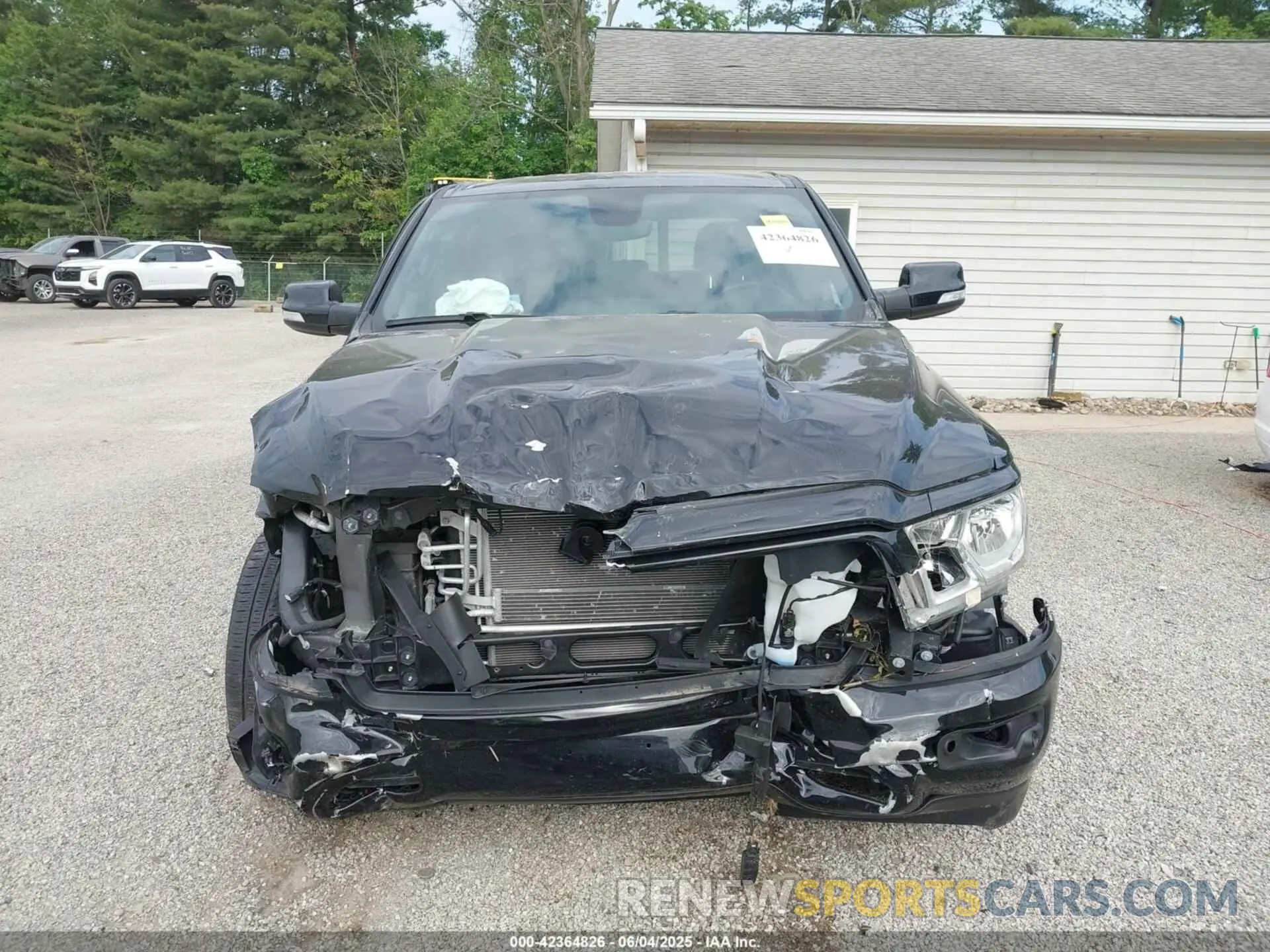 13 Photograph of a damaged car 1C6RRFFG9NN400564 RAM 1500 2022