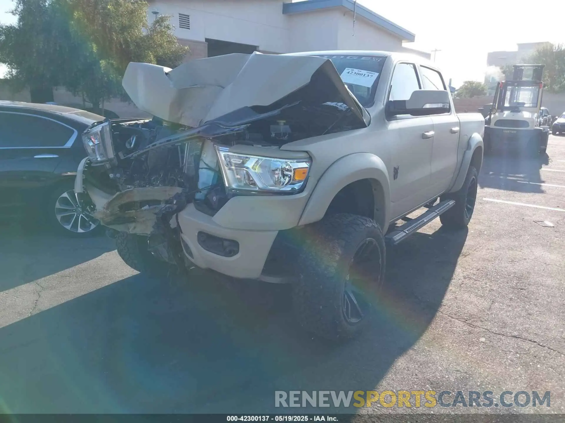 2 Photograph of a damaged car 1C6SRFFT0NN311092 RAM 1500 2022