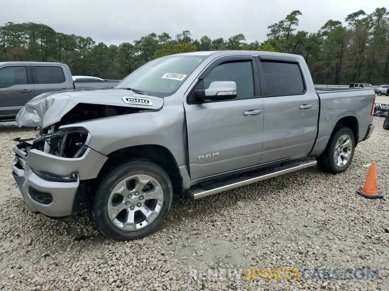 1 Photograph of a damaged car 1C6SRFFT0NN477547 RAM 1500 2022