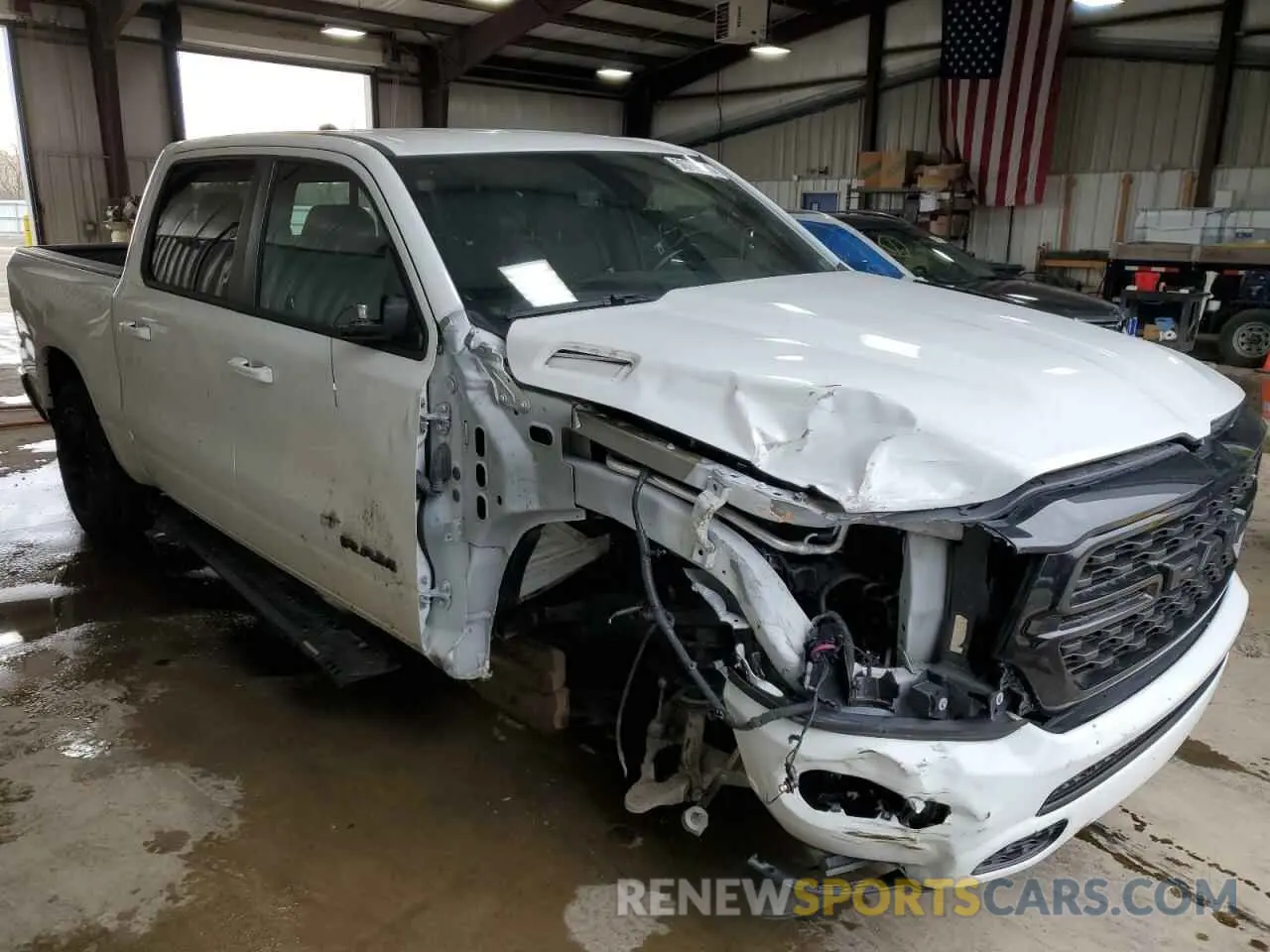 4 Photograph of a damaged car 1C6SRFFT1NN137100 RAM 1500 2022