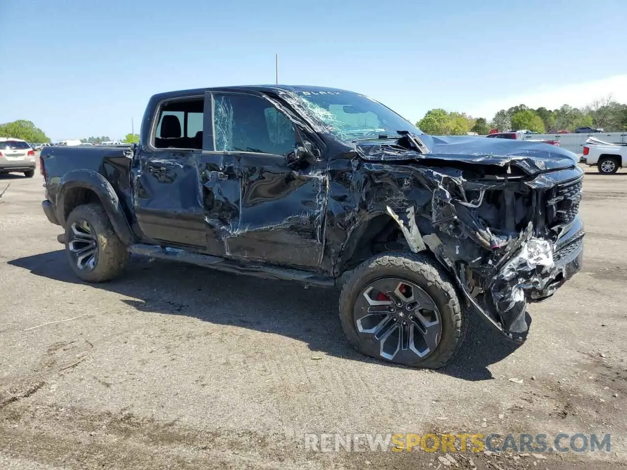 4 Photograph of a damaged car 1C6SRFFT4NN330955 RAM 1500 2022