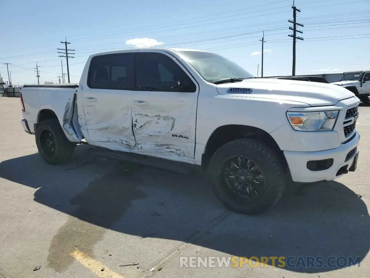 4 Photograph of a damaged car 1C6SRFFT7NN429379 RAM 1500 2022