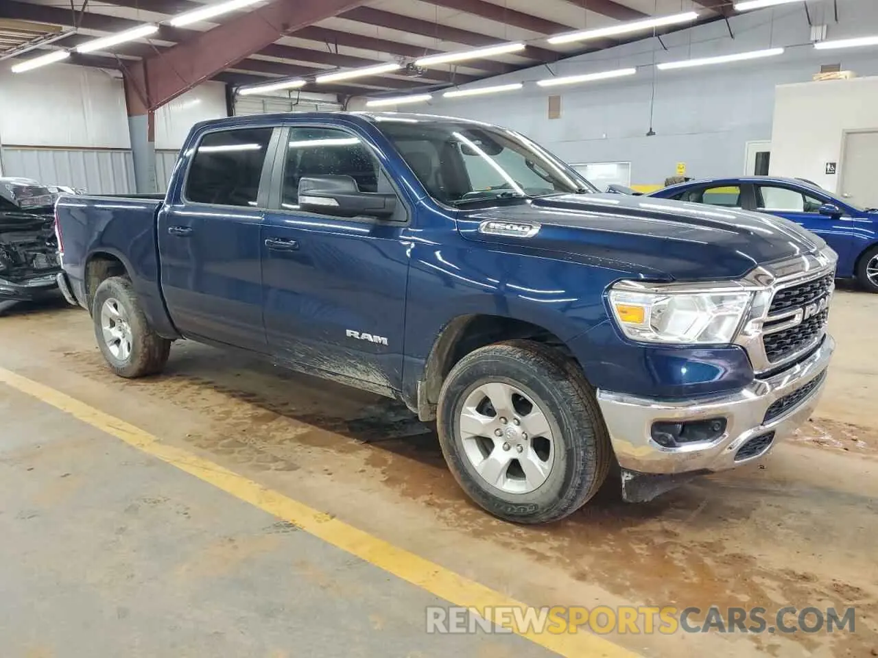 4 Photograph of a damaged car 1C6SRFFTXNN130677 RAM 1500 2022