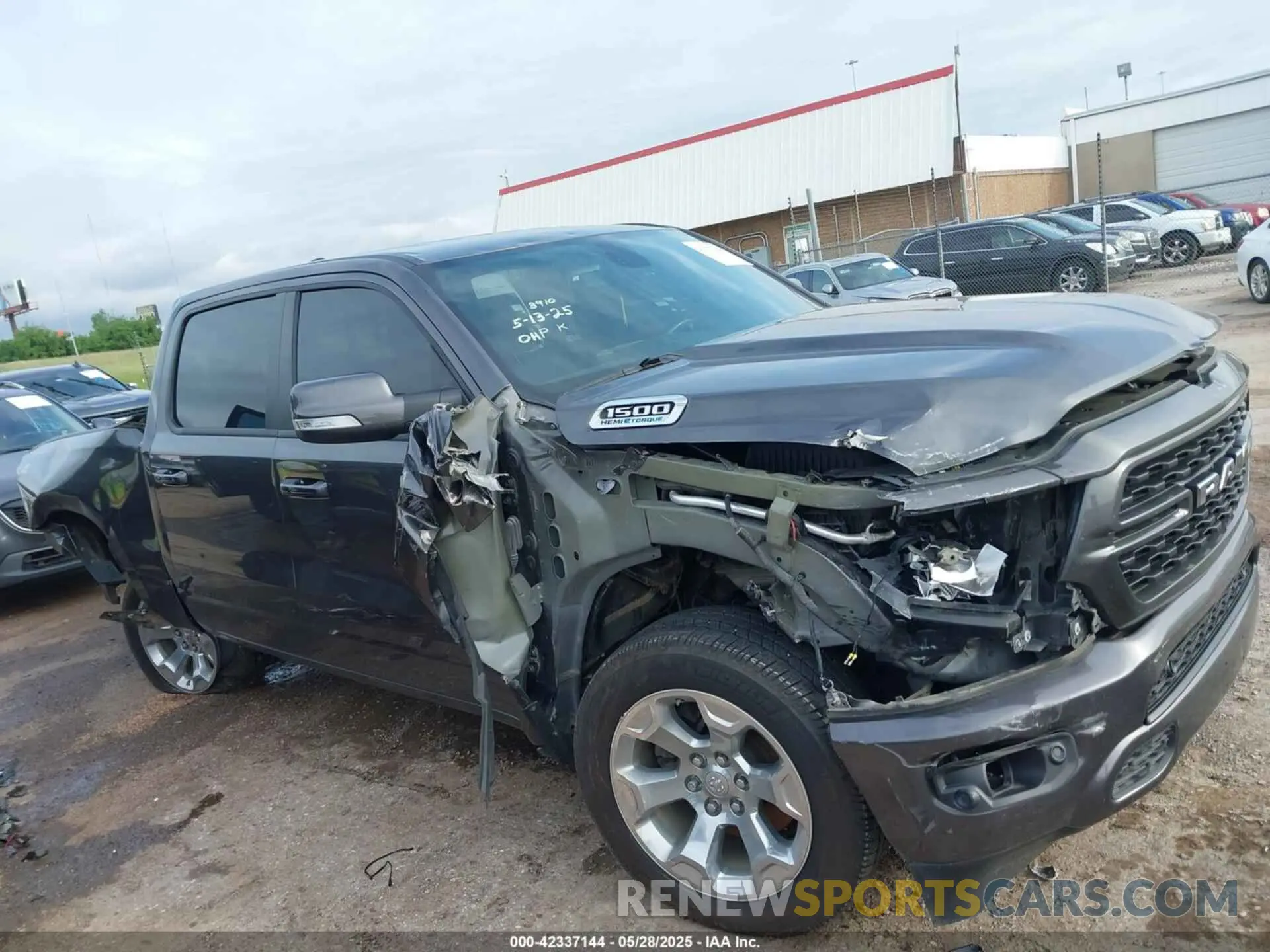 14 Photograph of a damaged car 1C6SRFFTXNN395065 RAM 1500 2022