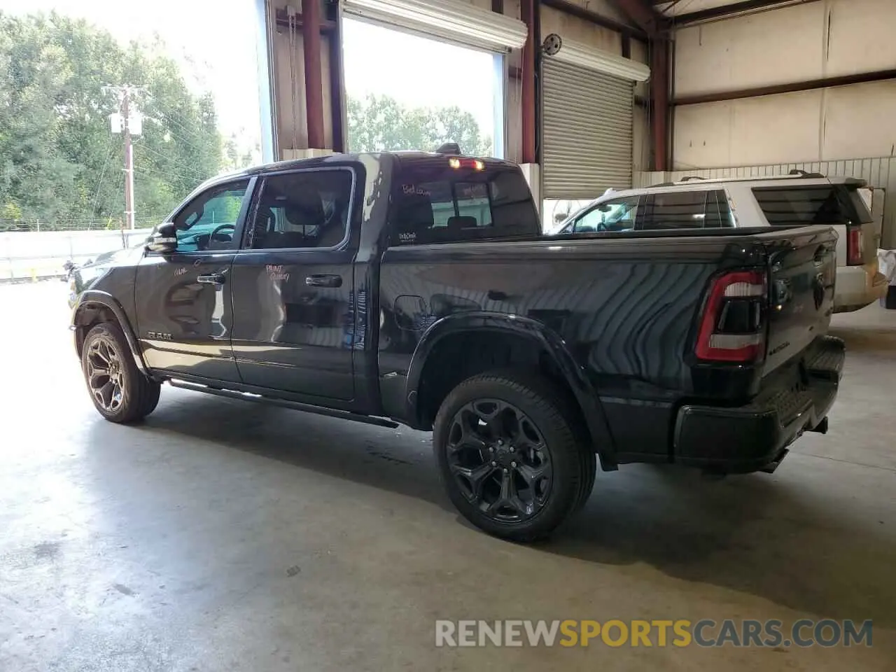 2 Photograph of a damaged car 1C6SRFHT1NN297250 RAM 1500 2022