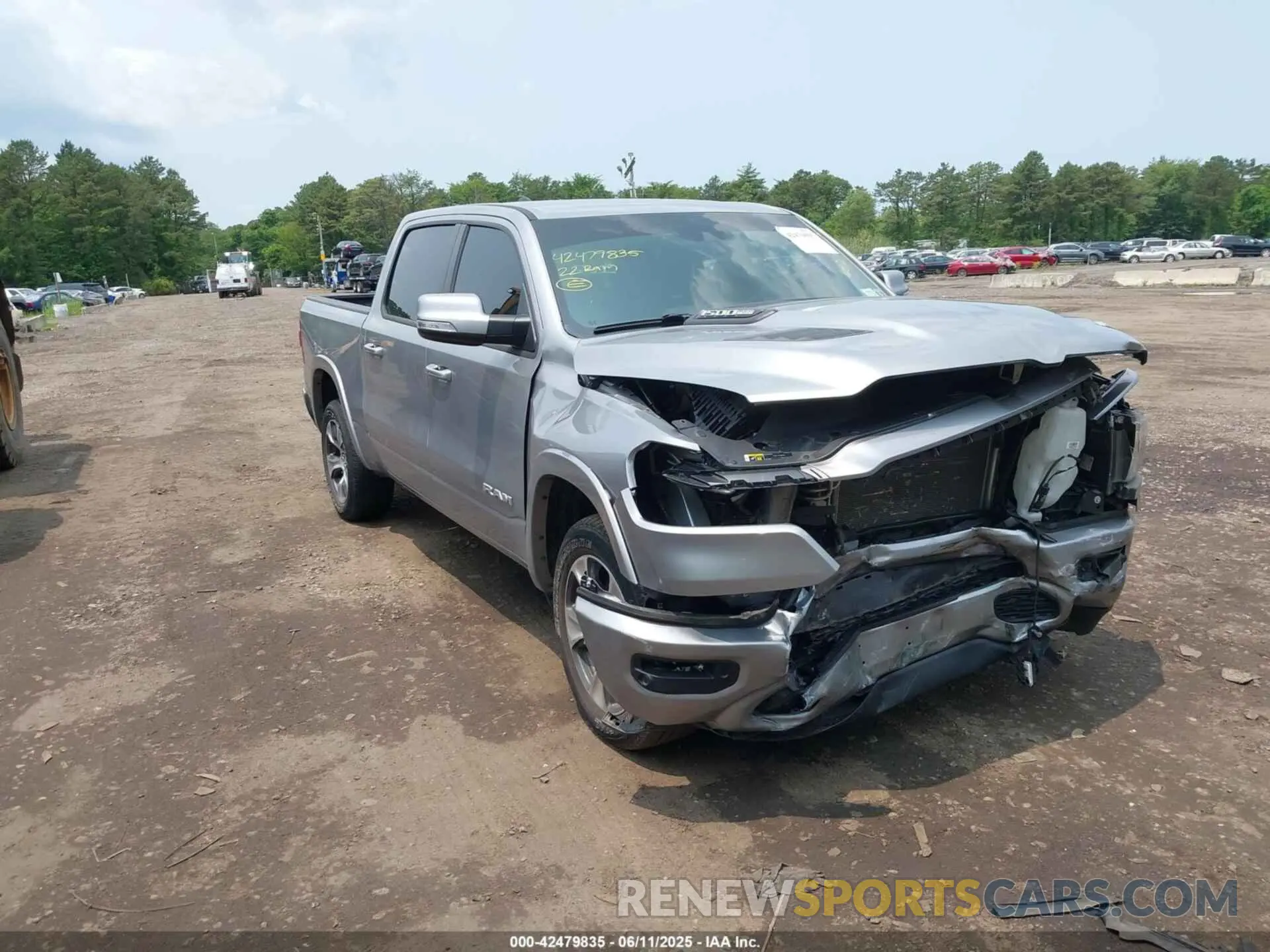 1 Photograph of a damaged car 1C6SRFJMXNN223943 RAM 1500 2022