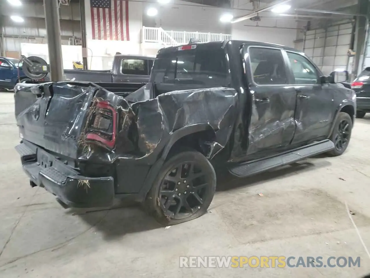 3 Photograph of a damaged car 1C6SRFJT0NN474798 RAM 1500 2022