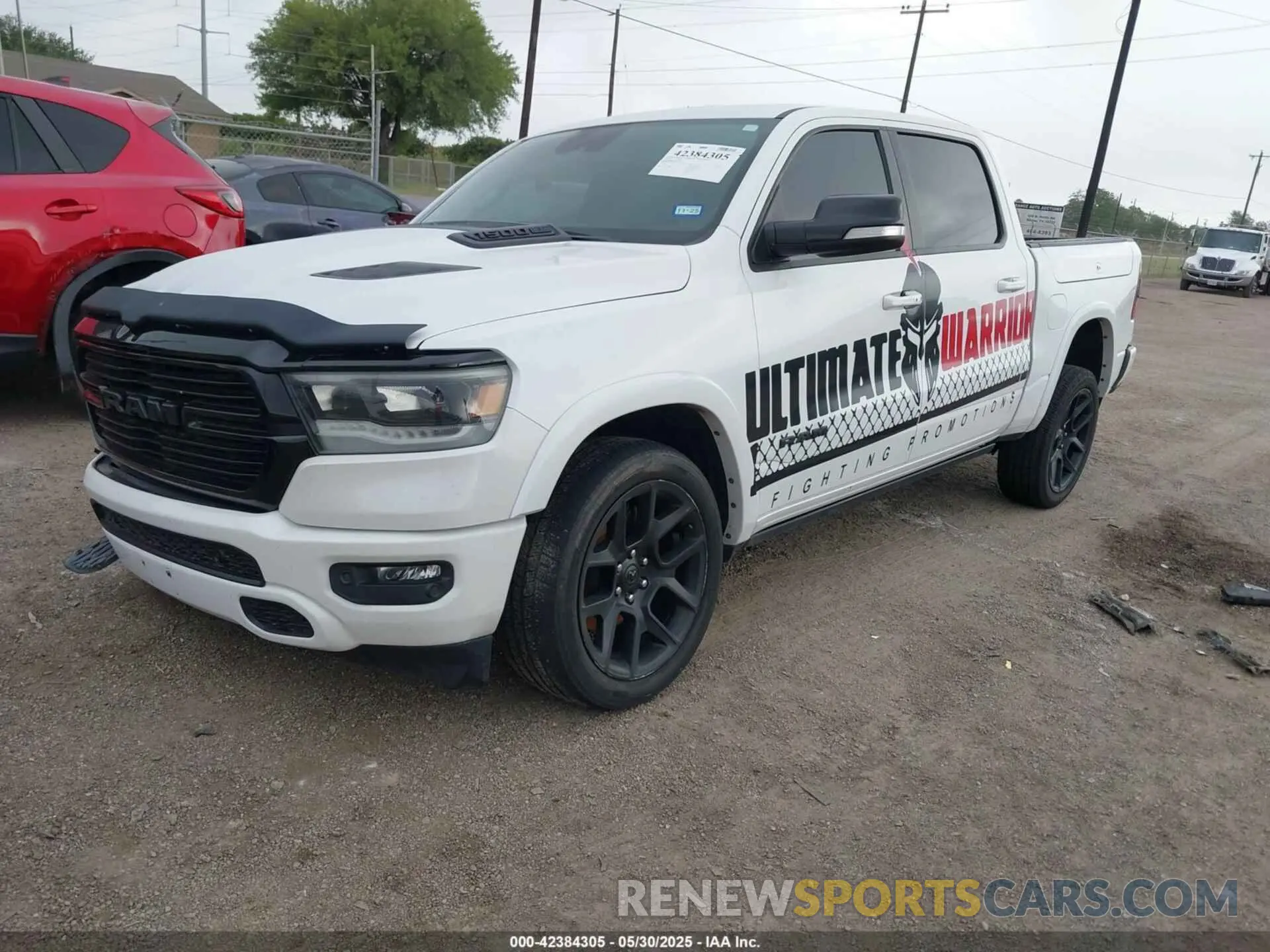 2 Photograph of a damaged car 1C6SRFJTXNN129844 RAM 1500 2022