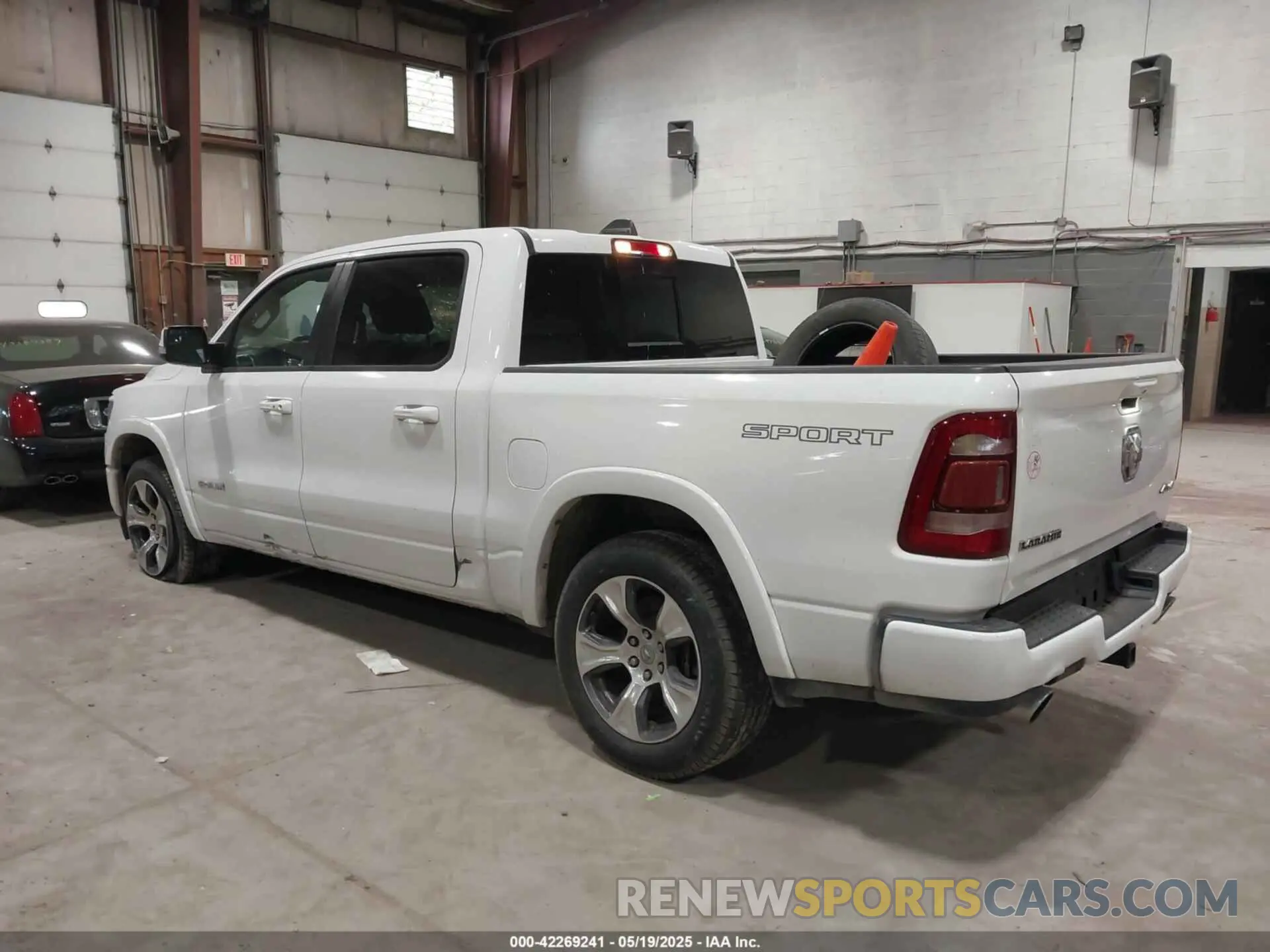 3 Photograph of a damaged car 1C6SRFJTXNN222654 RAM 1500 2022