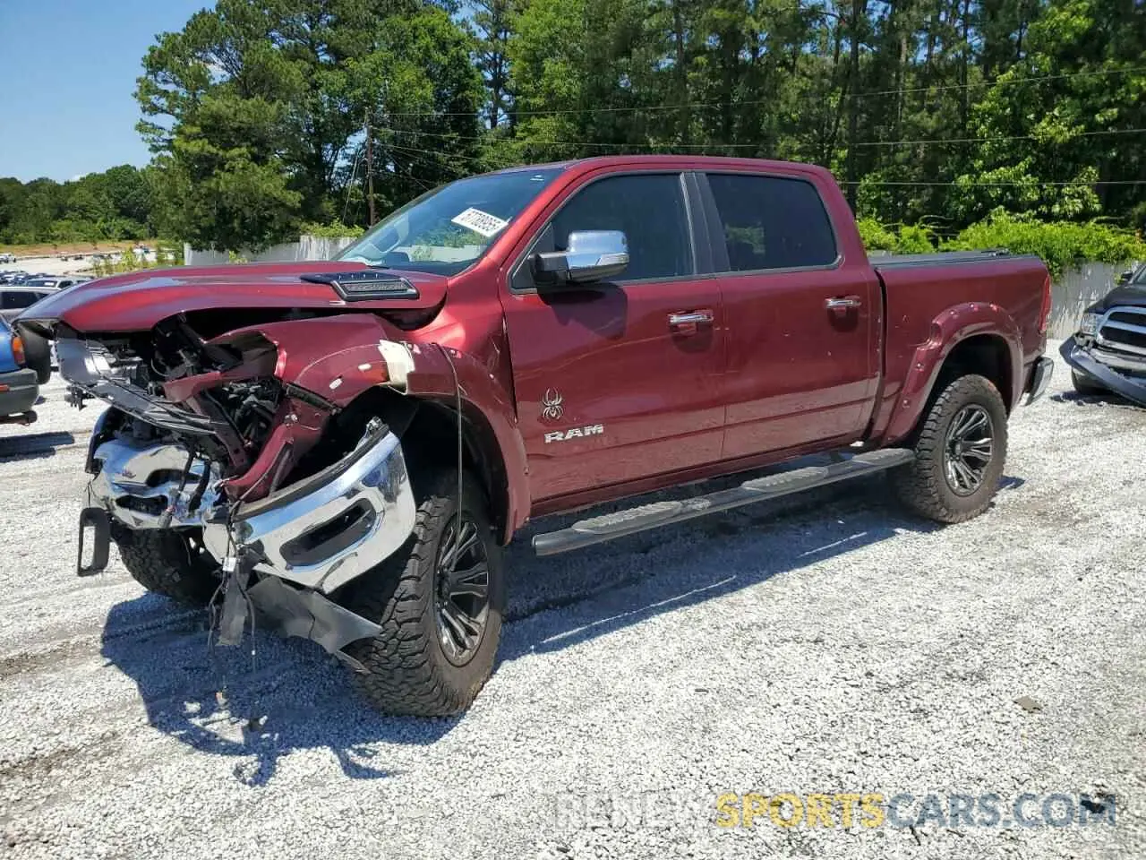 1 Photograph of a damaged car 1C6SRFJTXNN310572 RAM 1500 2022