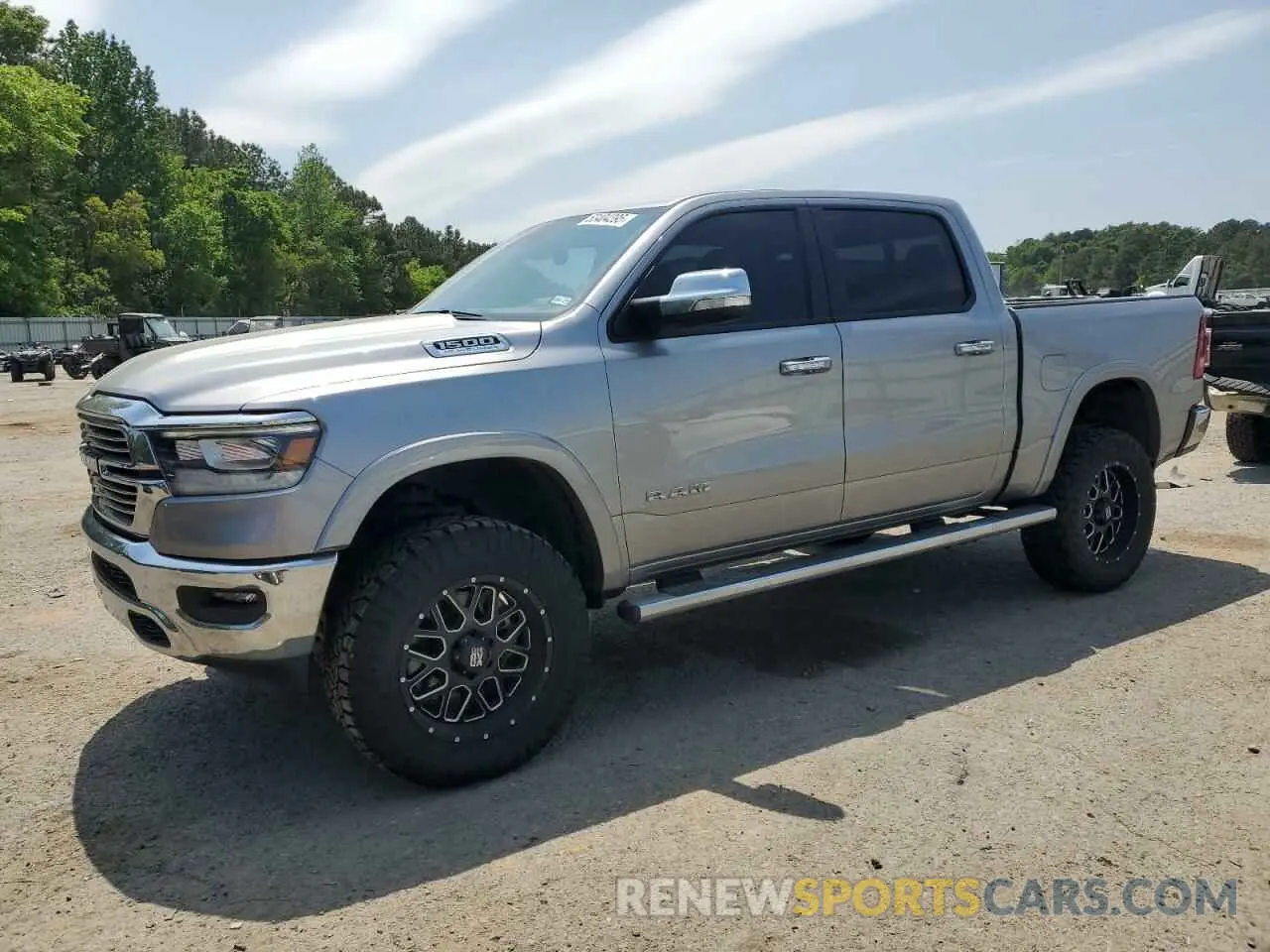 1 Photograph of a damaged car 1C6SRFJTXNN429786 RAM 1500 2022