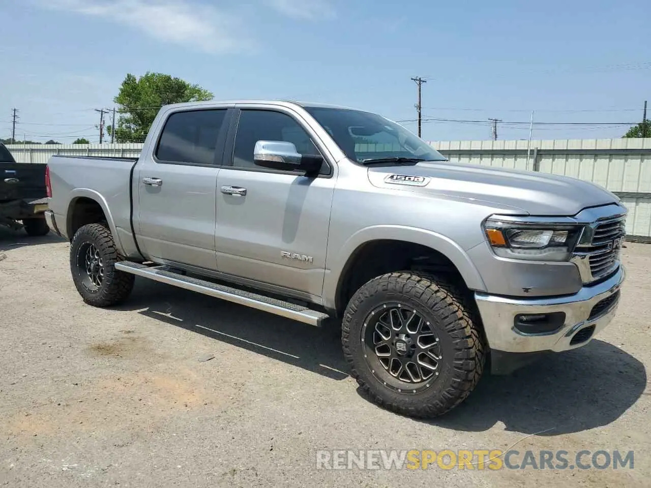 4 Photograph of a damaged car 1C6SRFJTXNN429786 RAM 1500 2022