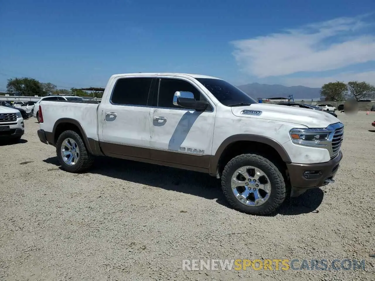 4 Photograph of a damaged car 1C6SRFKT5NN109323 RAM 1500 2022