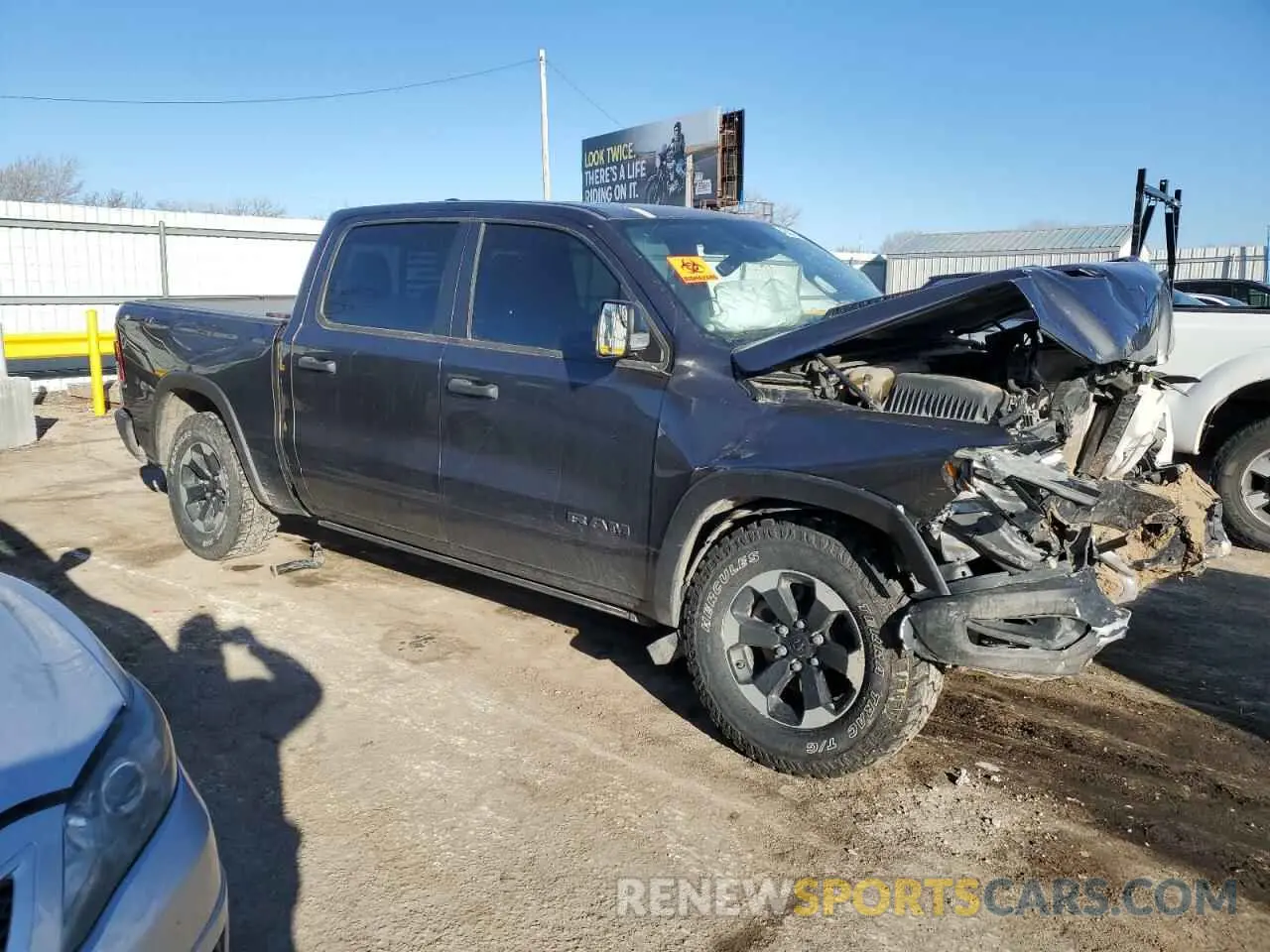 4 Photograph of a damaged car 1C6SRFLM3NN204700 RAM 1500 2022