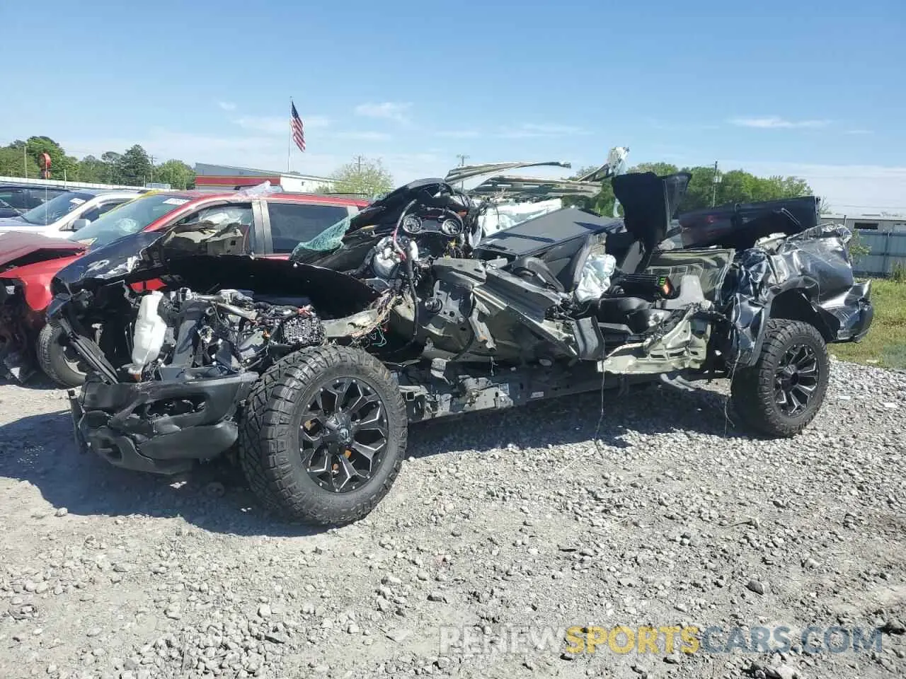 1 Photograph of a damaged car 1C6SRFLT1NN112993 RAM 1500 2022