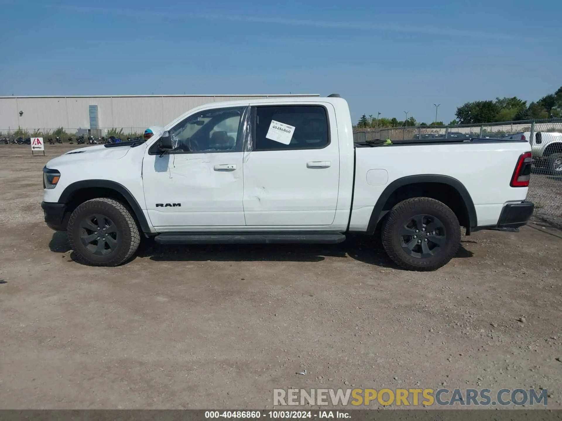 14 Photograph of a damaged car 1C6SRFLTXNN338532 RAM 1500 2022