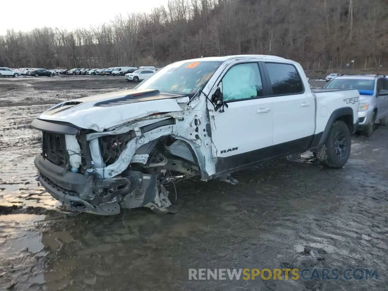 1 Photograph of a damaged car 1C6SRFU90NN388911 RAM 1500 2022
