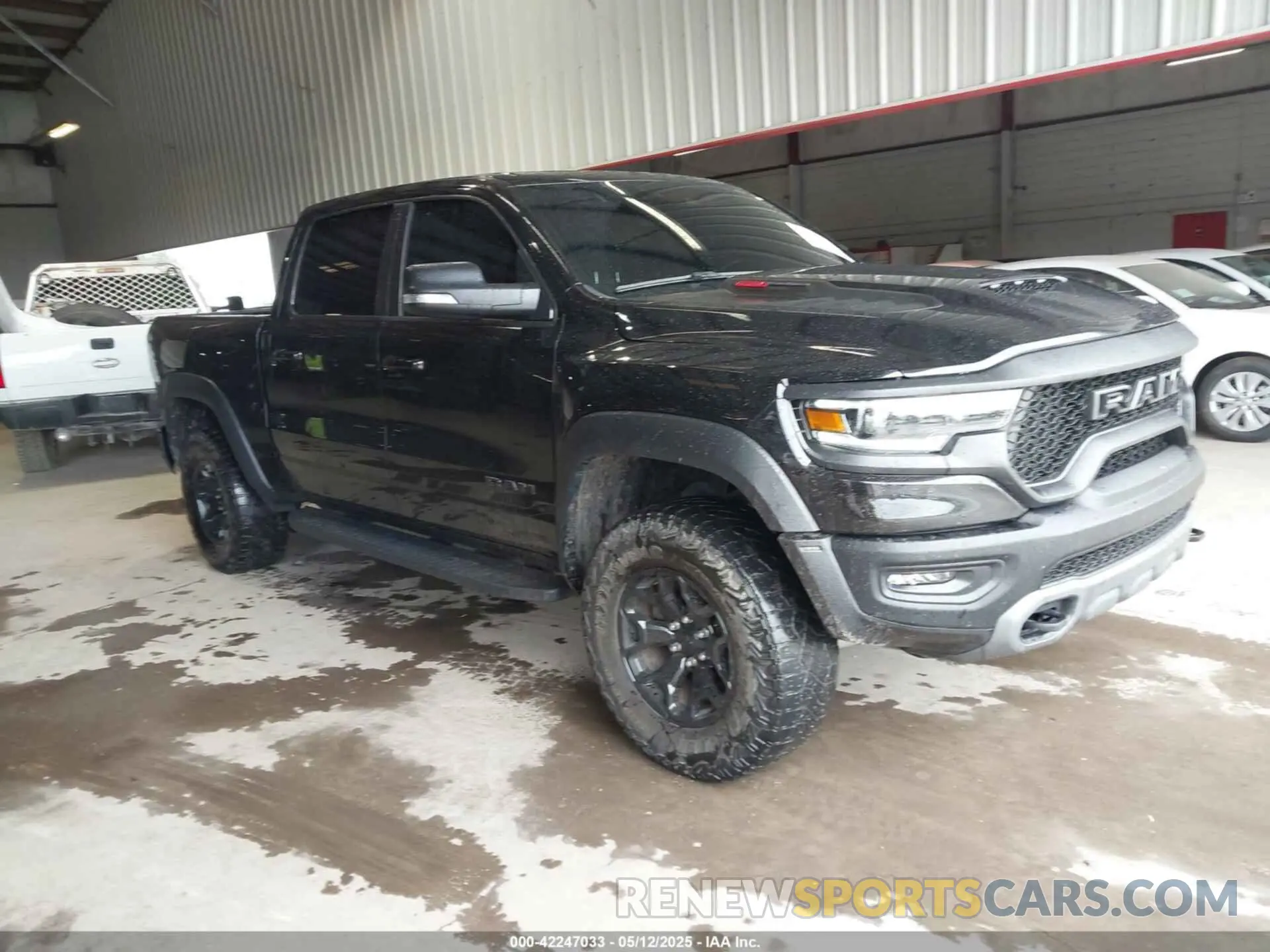 1 Photograph of a damaged car 1C6SRFU91NN319239 RAM 1500 2022