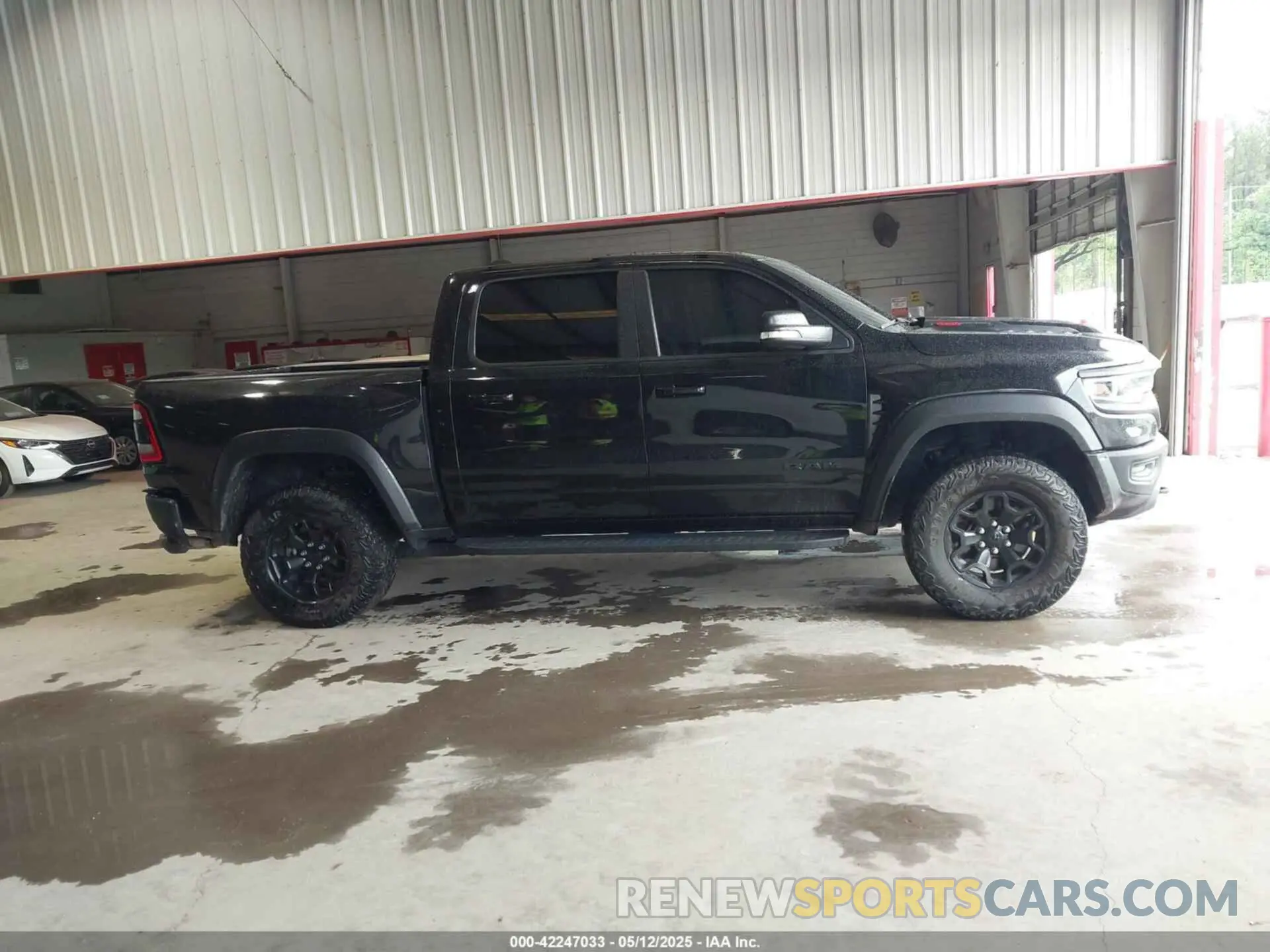 13 Photograph of a damaged car 1C6SRFU91NN319239 RAM 1500 2022