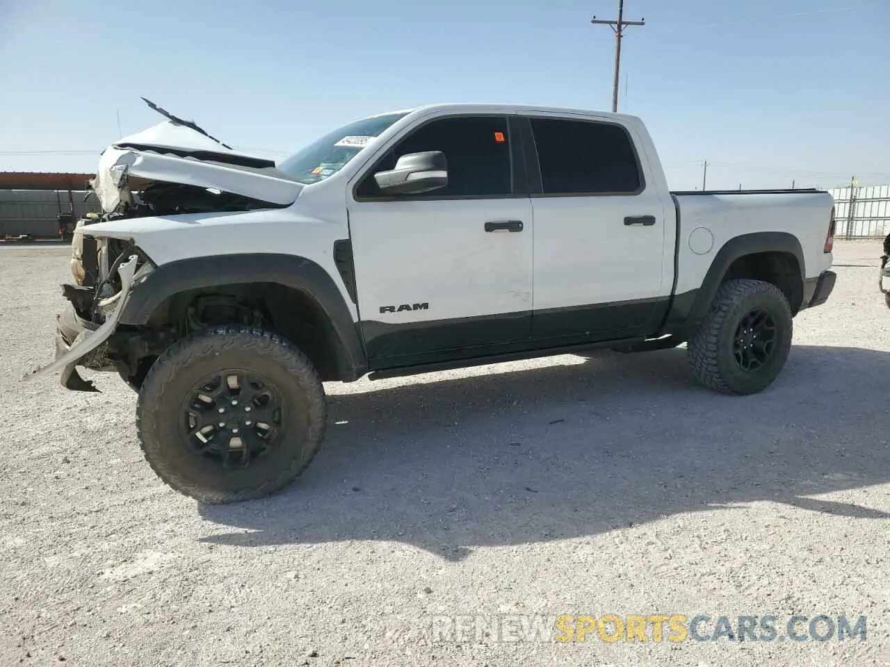 1 Photograph of a damaged car 1C6SRFU92NN270357 RAM 1500 2022