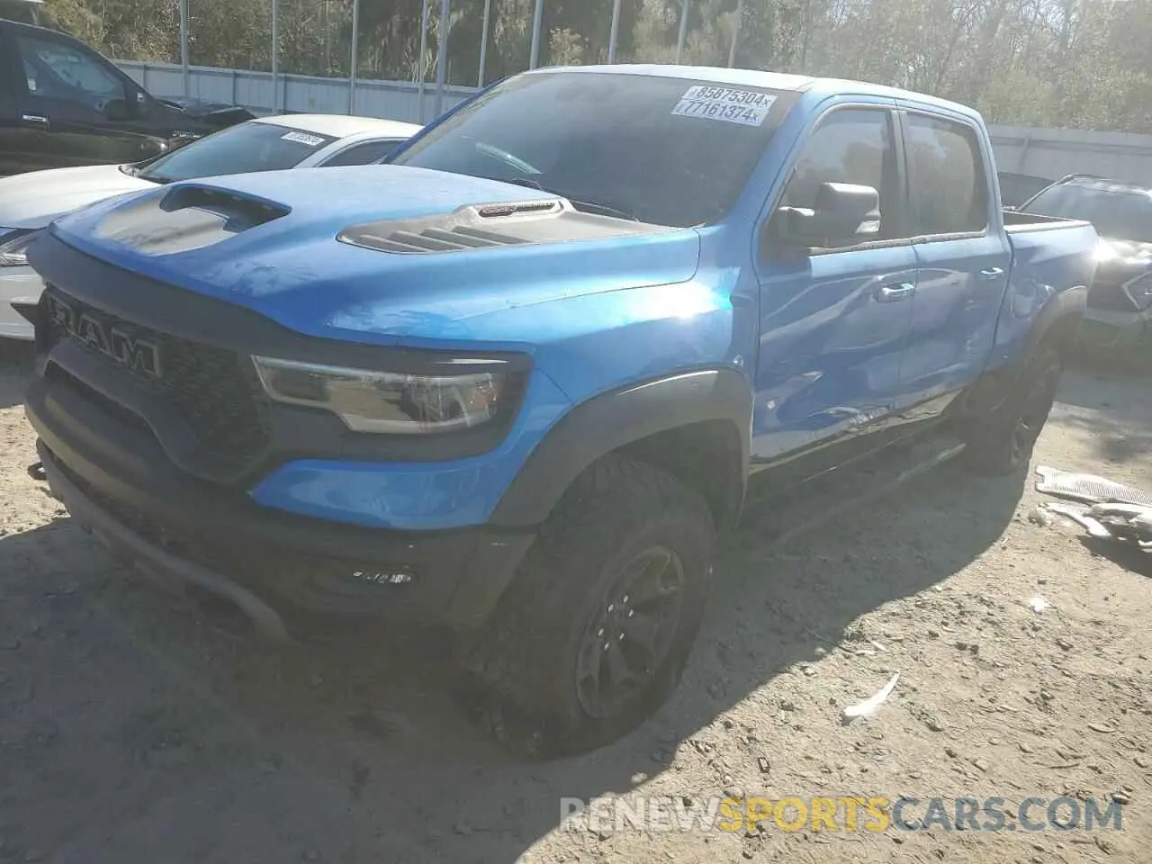 1 Photograph of a damaged car 1C6SRFU93NN229879 RAM 1500 2022
