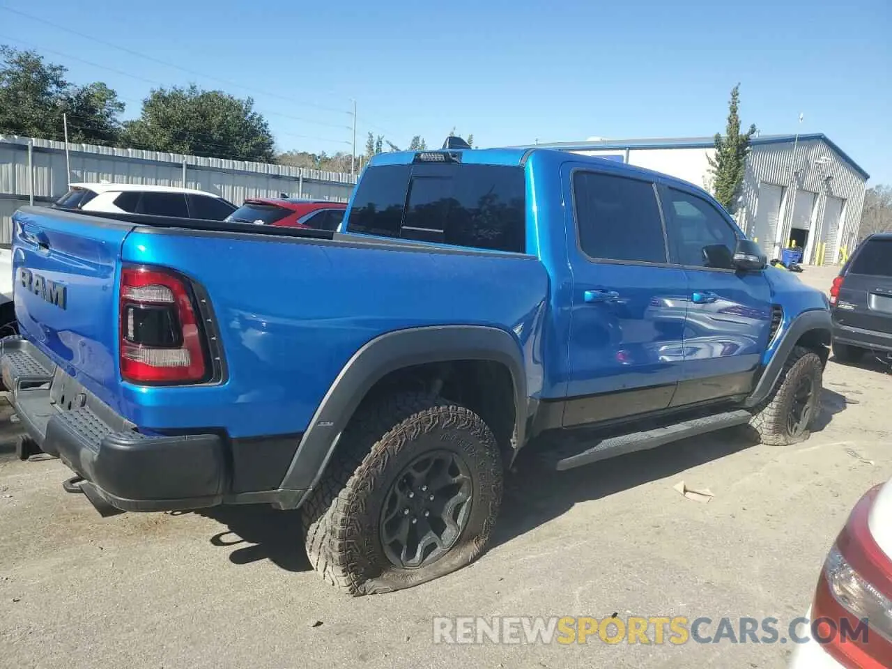 3 Photograph of a damaged car 1C6SRFU93NN229879 RAM 1500 2022