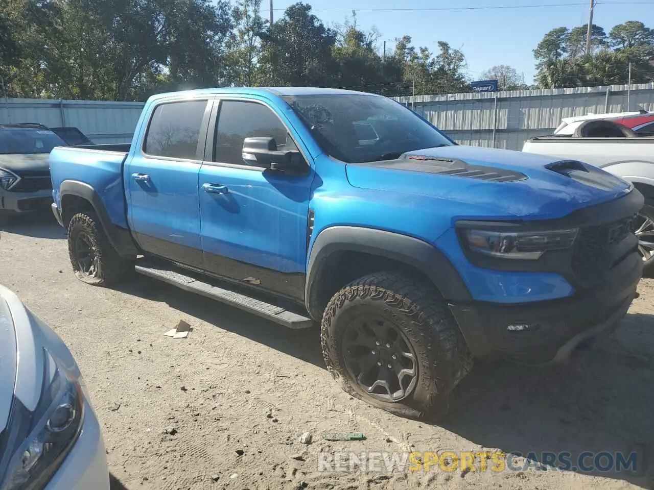 4 Photograph of a damaged car 1C6SRFU93NN229879 RAM 1500 2022