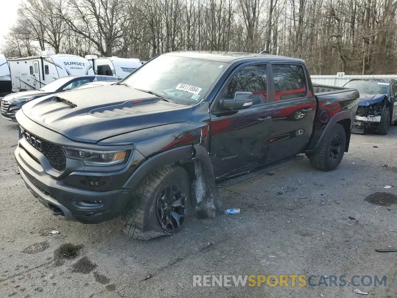 1 Photograph of a damaged car 1C6SRFU93NN252272 RAM 1500 2022