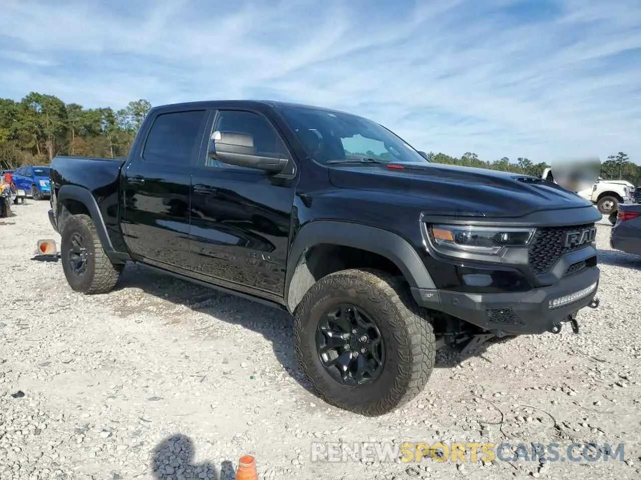 4 Photograph of a damaged car 1C6SRFU93NN335250 RAM 1500 2022