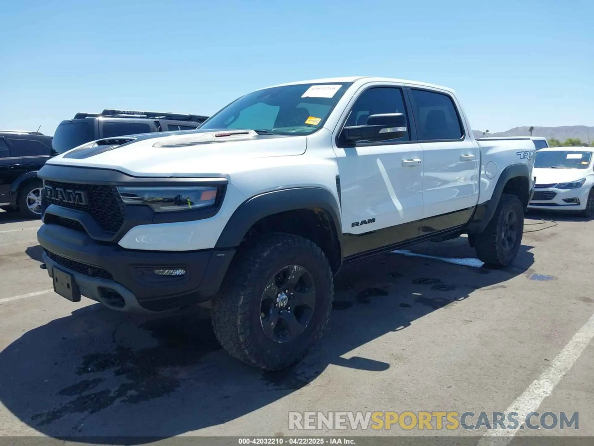 2 Photograph of a damaged car 1C6SRFU95NN245954 RAM 1500 2022