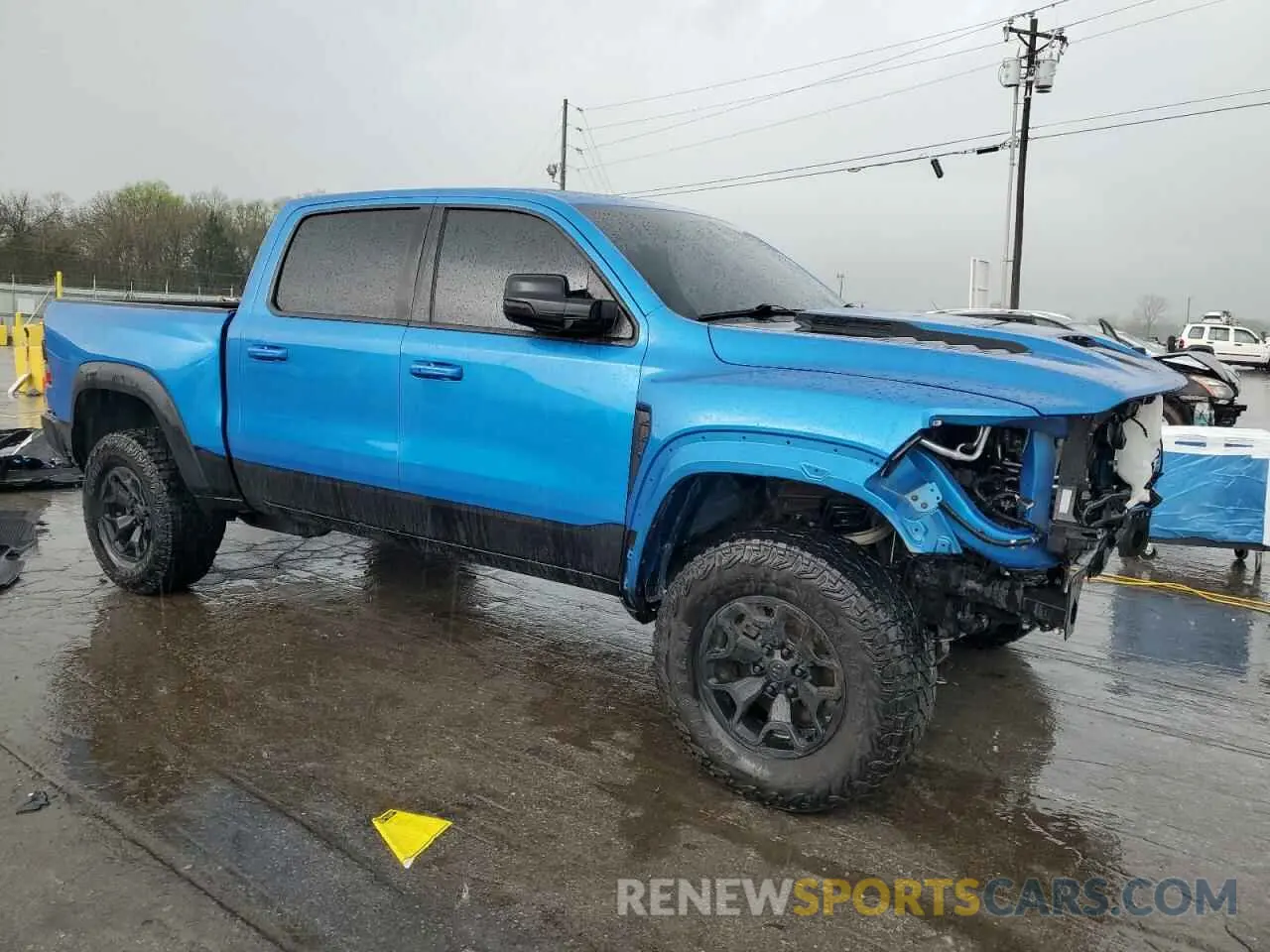 4 Photograph of a damaged car 1C6SRFU95NN322094 RAM 1500 2022