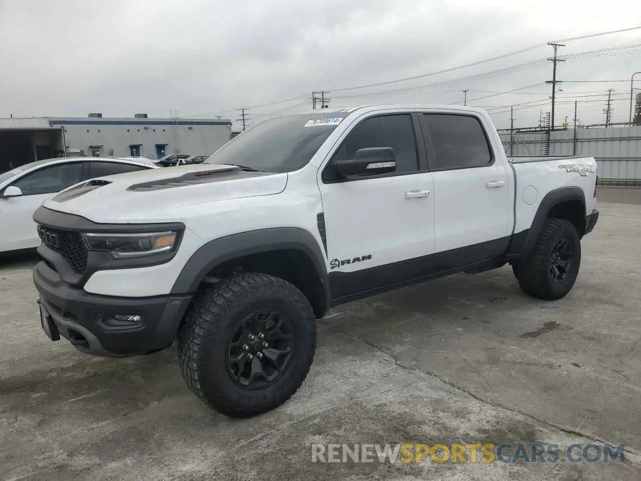 1 Photograph of a damaged car 1C6SRFU95NN357489 RAM 1500 2022