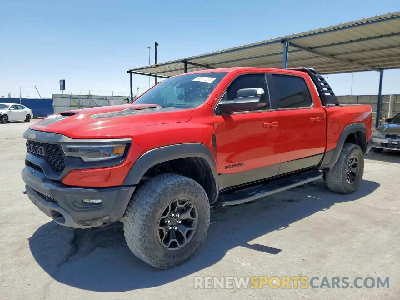 1 Photograph of a damaged car 1C6SRFU96NN364371 RAM 1500 2022
