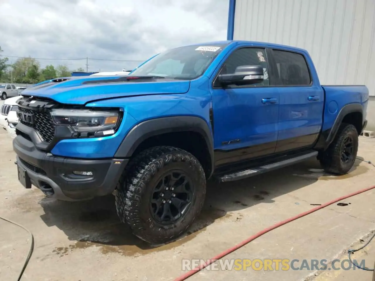 1 Photograph of a damaged car 1C6SRFU99NN147798 RAM 1500 2022