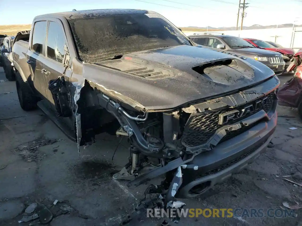 4 Photograph of a damaged car 1C6SRFU99NN303922 RAM 1500 2022