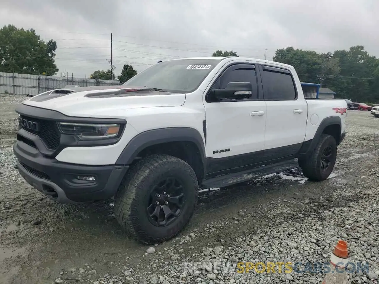 1 Photograph of a damaged car 1C6SRFU99NN318694 RAM 1500 2022