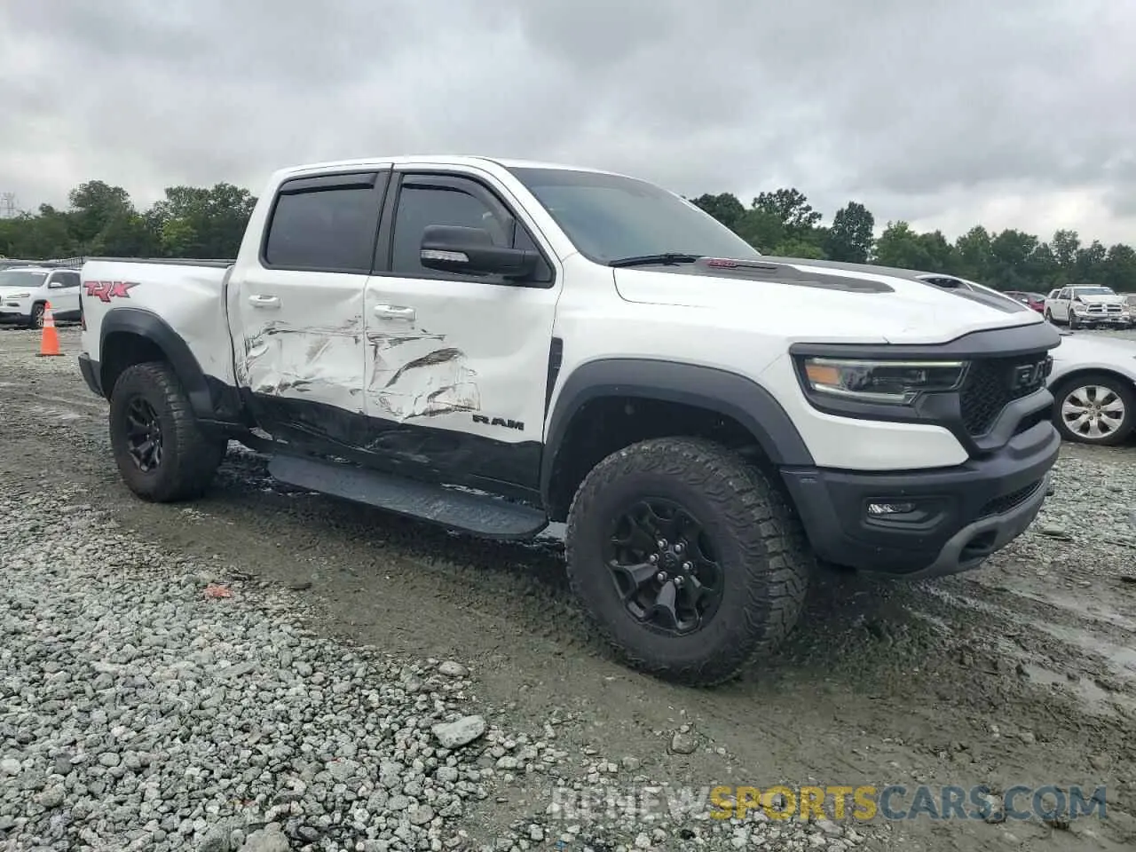 4 Photograph of a damaged car 1C6SRFU99NN318694 RAM 1500 2022