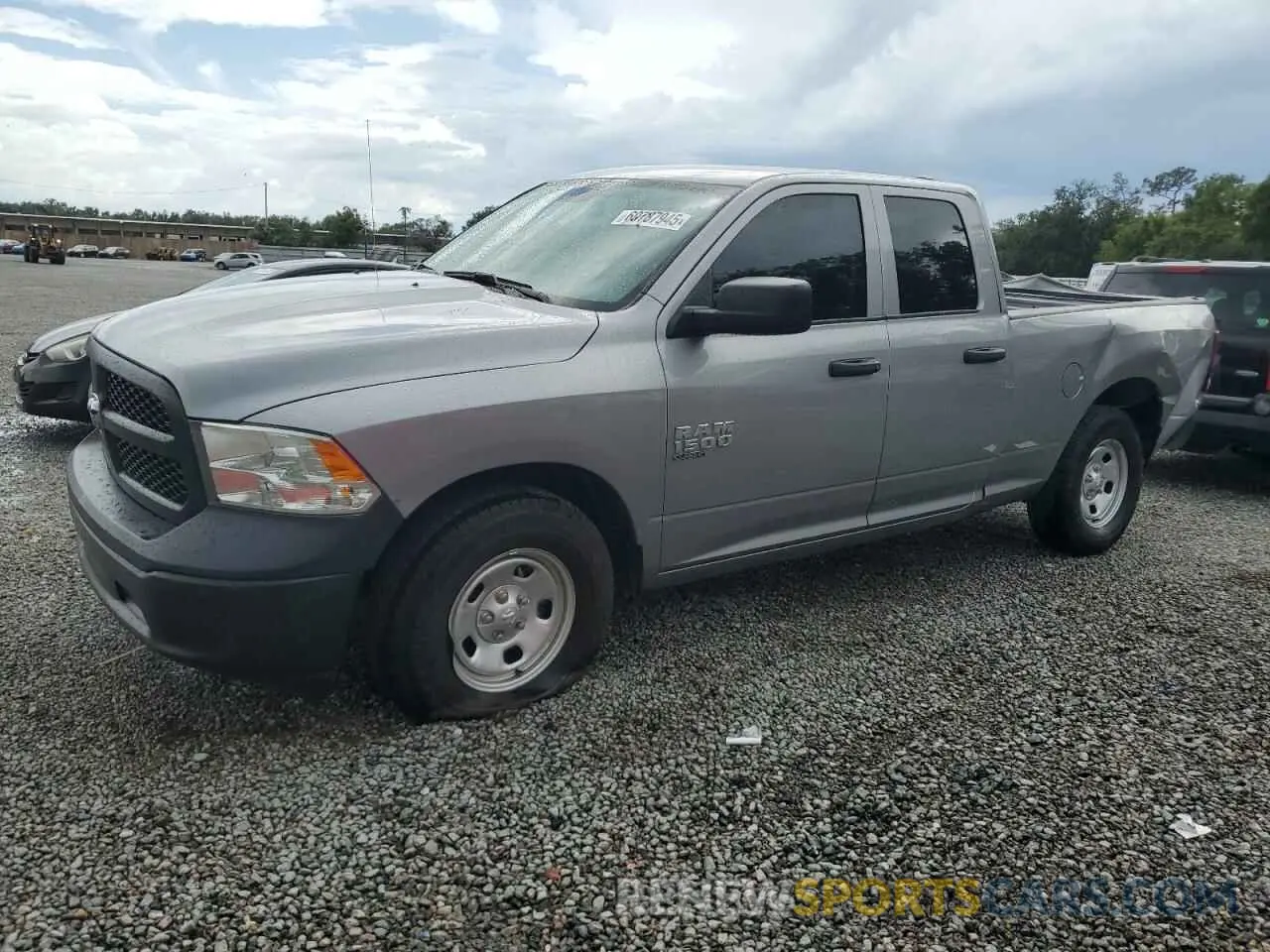 1 Photograph of a damaged car 1C6RR6FG9PS594310 RAM 1500 2023