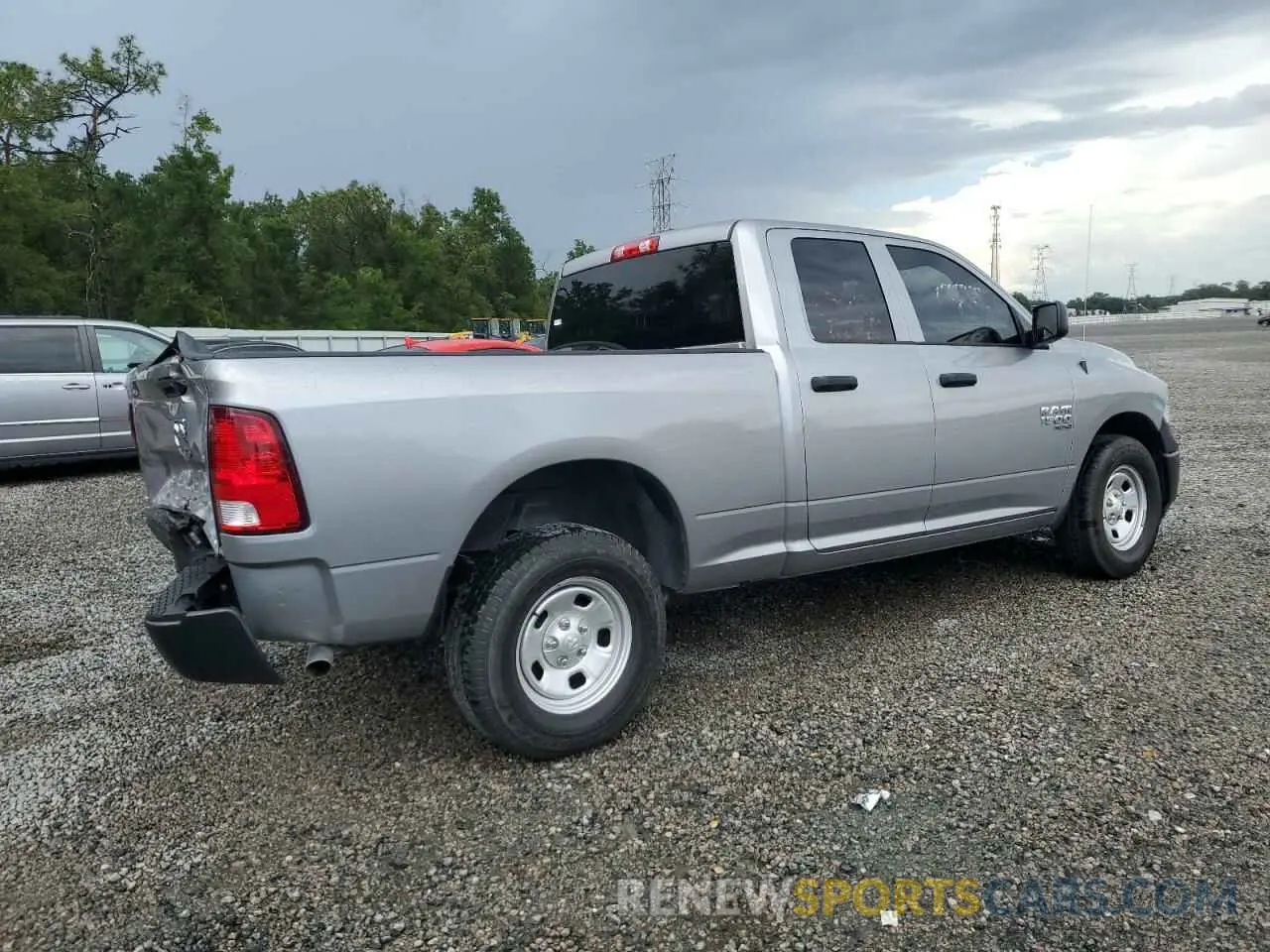 3 Photograph of a damaged car 1C6RR6FG9PS594310 RAM 1500 2023