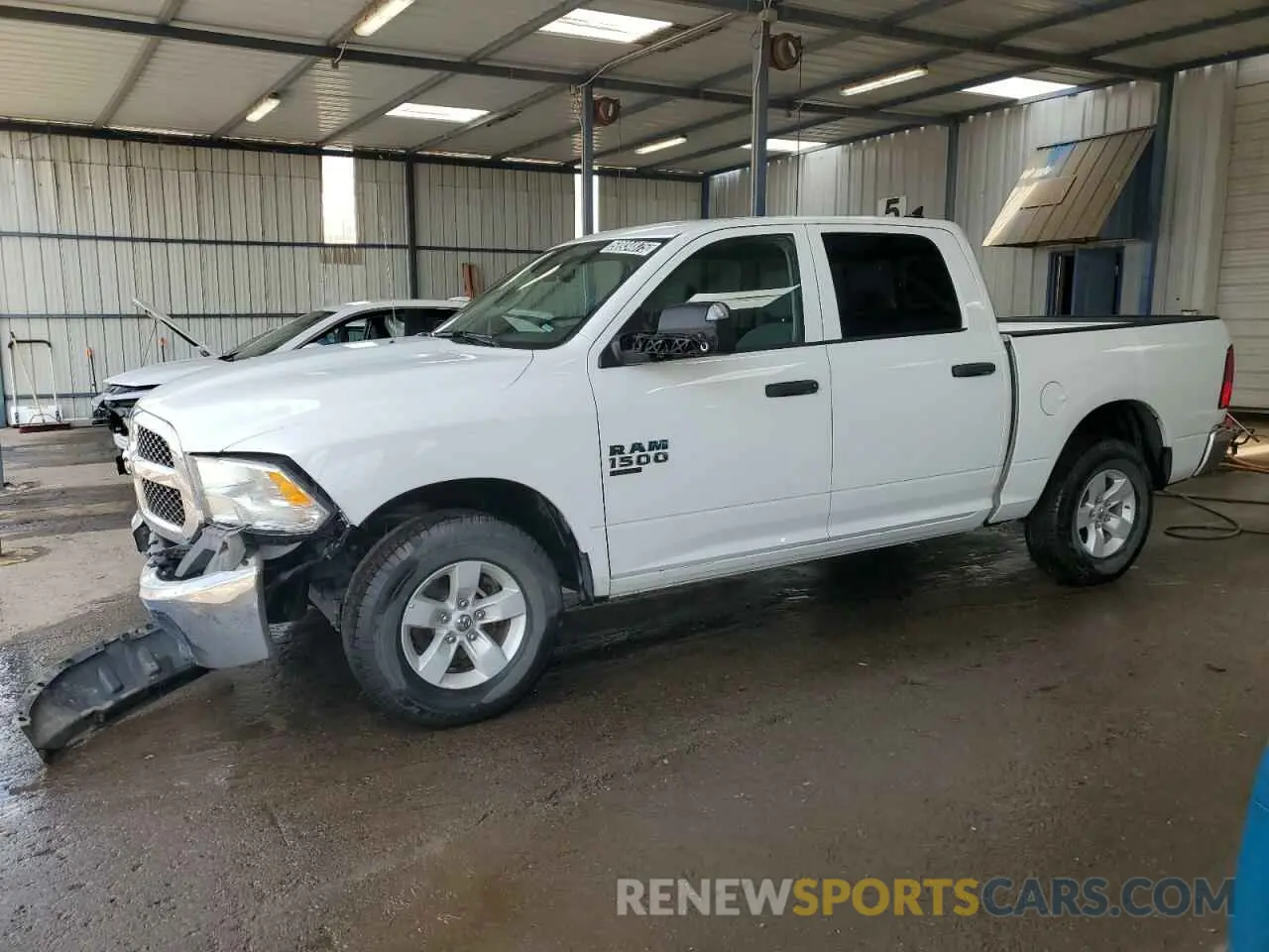 1 Photograph of a damaged car 1C6RR7LG9PS517687 RAM 1500 2023