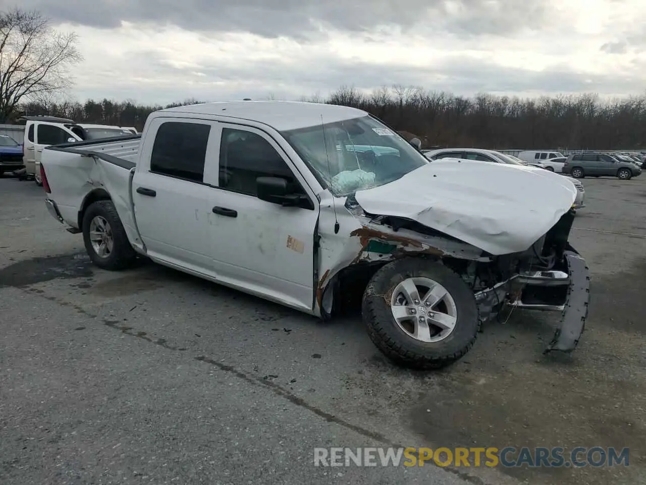 4 Photograph of a damaged car 1C6RR7XT3PS581893 RAM 1500 2023