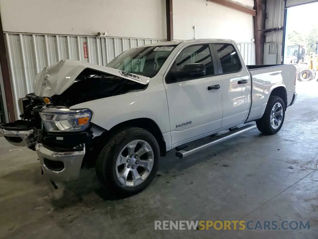 1 Photograph of a damaged car 1C6RREBT0PN586091 RAM 1500 2023