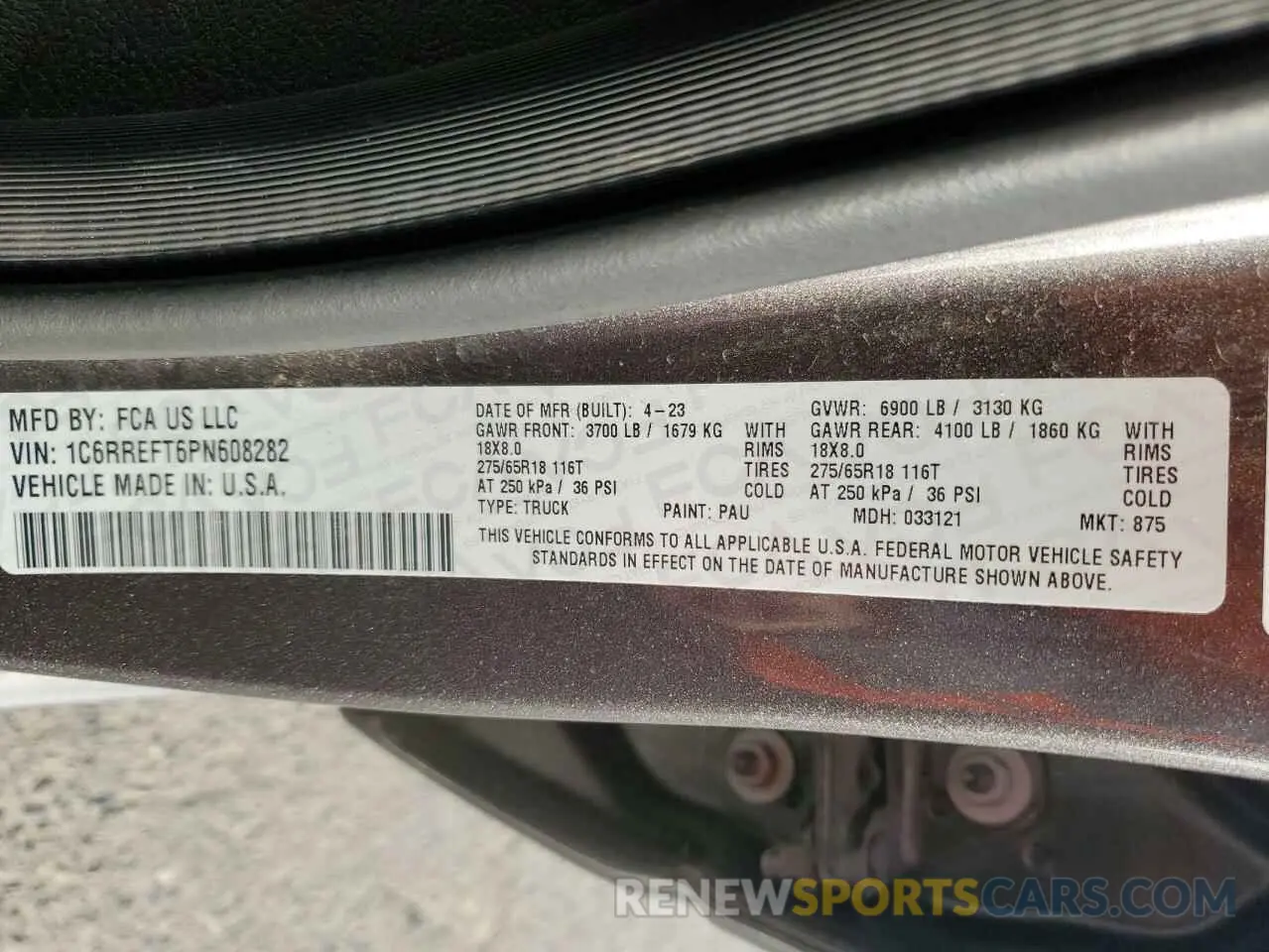 13 Photograph of a damaged car 1C6RREFT6PN608282 RAM 1500 2023