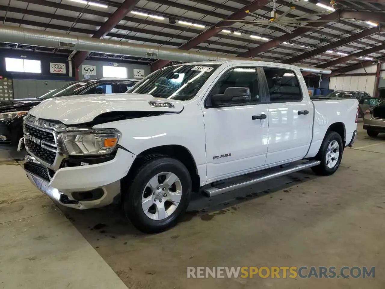 1 Photograph of a damaged car 1C6RREFT7PN614348 RAM 1500 2023