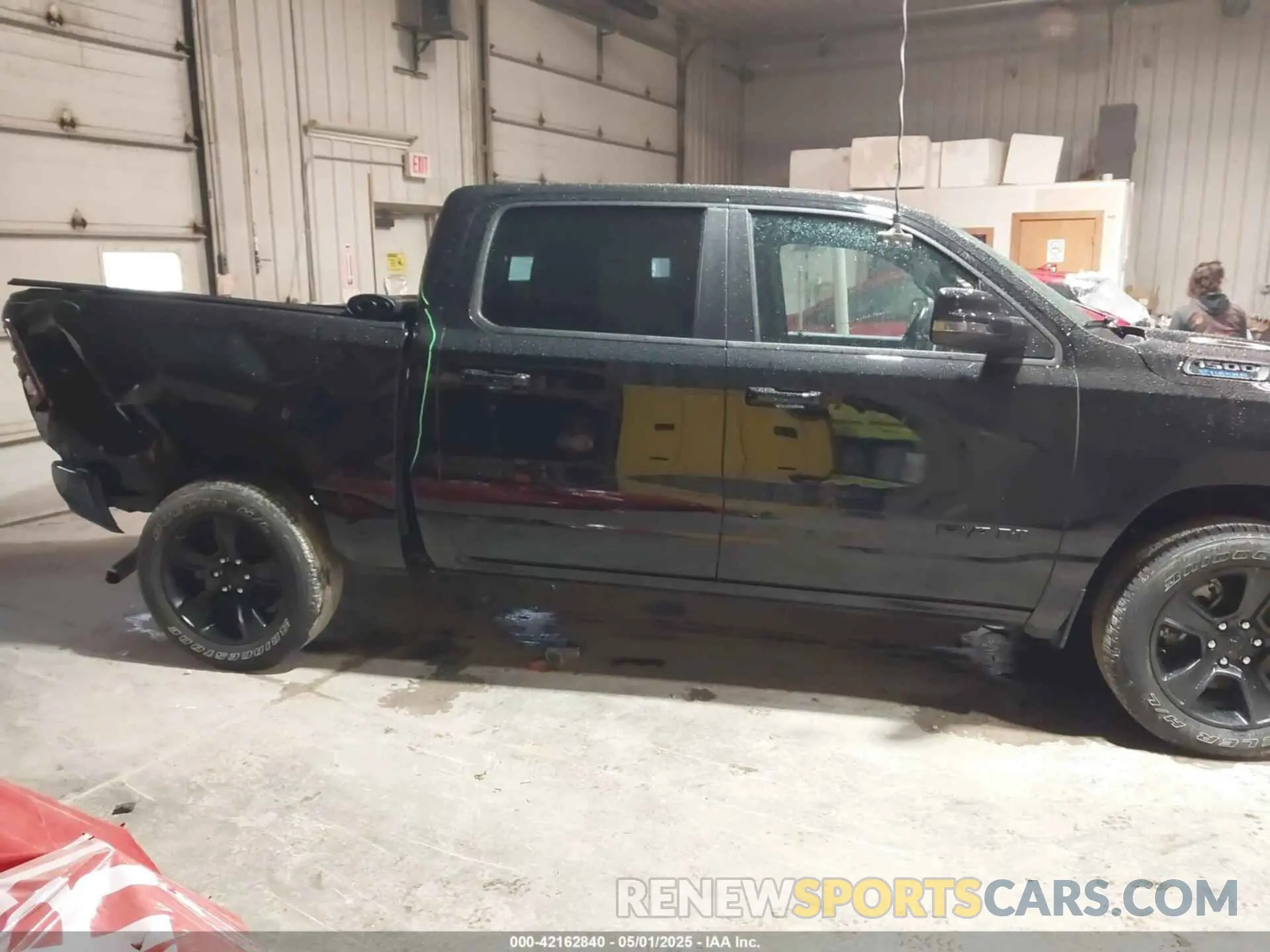 13 Photograph of a damaged car 1C6RRFFG3PN591272 RAM 1500 2023