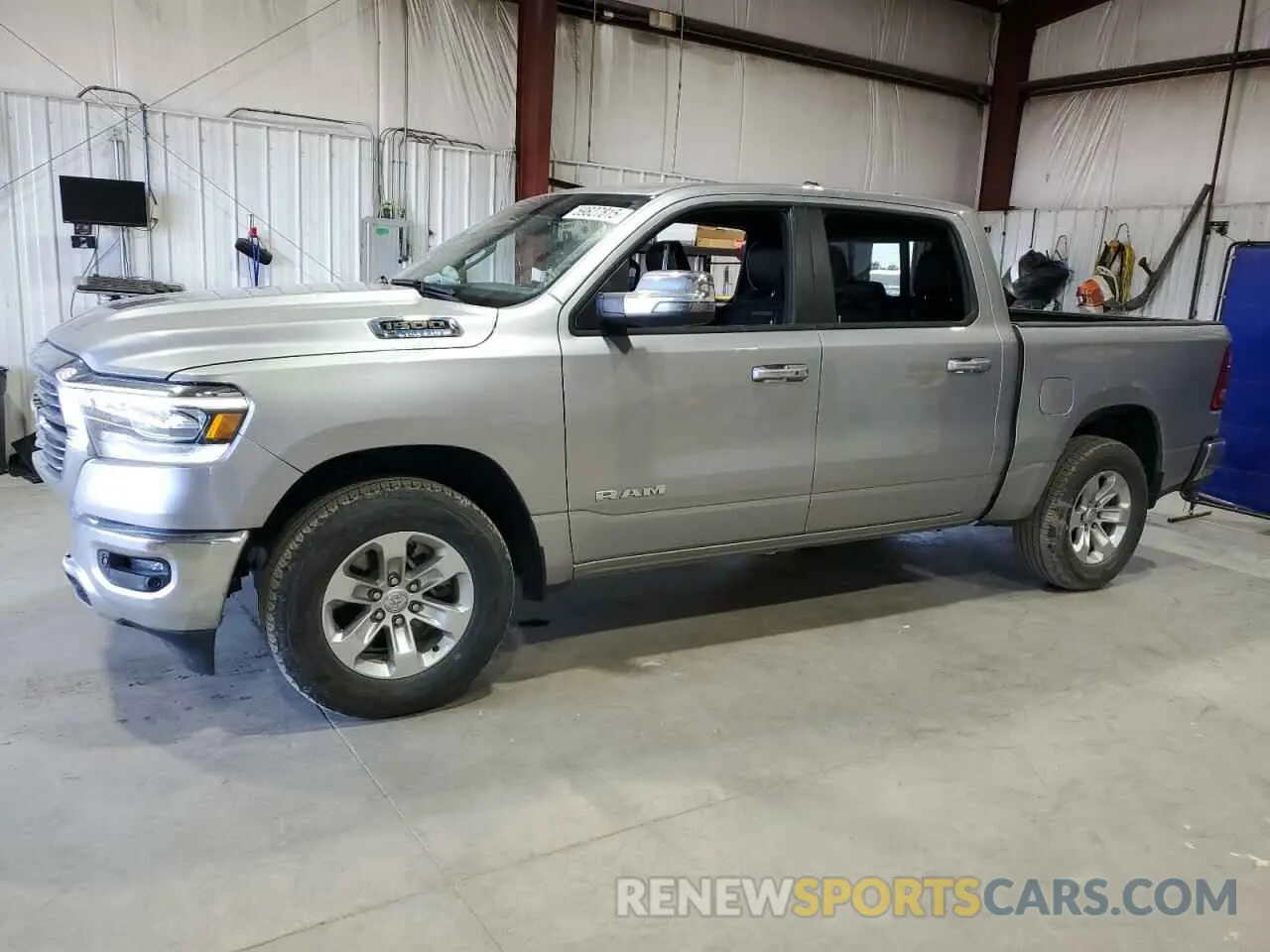 1 Photograph of a damaged car 1C6RRFJG0PN614983 RAM 1500 2023